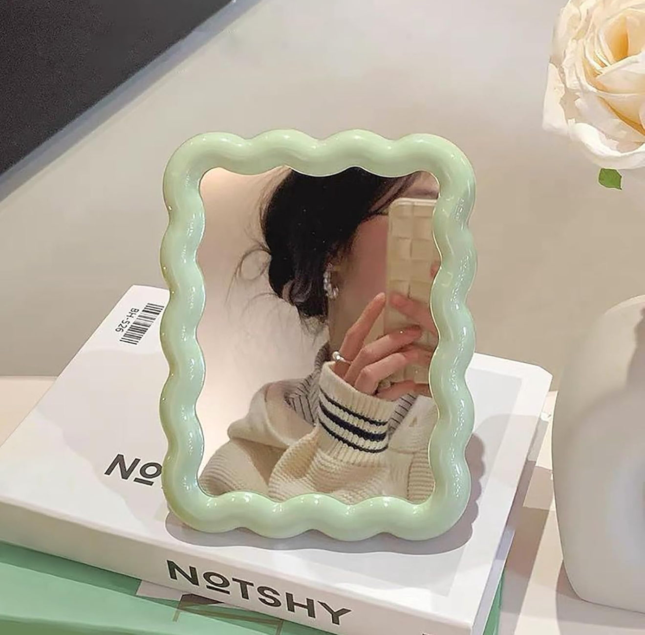 Wave shaped table mirror