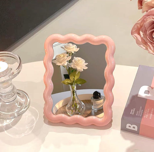 Wave shaped table mirror